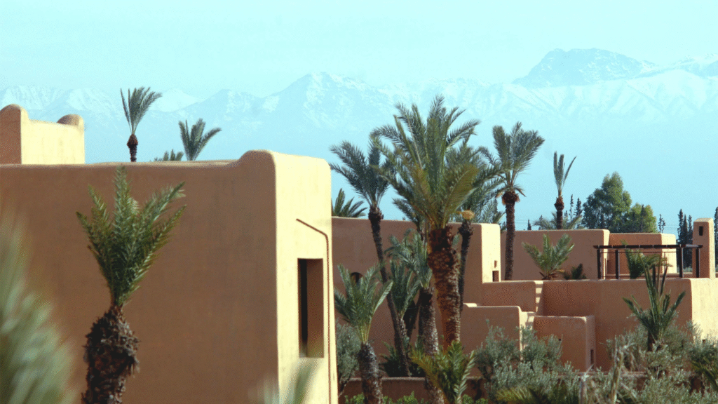Luxury desert camp setup with Atlas Mountains in background