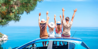 Family enjoying the view from their car during a Morocco road trip