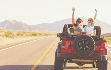 Two travelers enjoying a jeep ride through the Moroccan desert