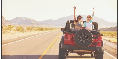 Two travelers enjoying a jeep ride through the Moroccan desert